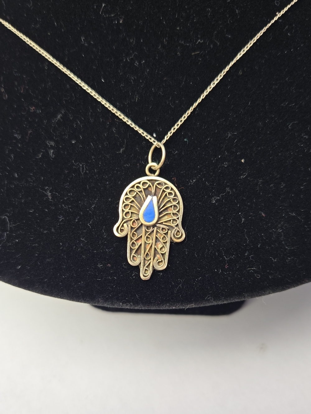 Silver Hamsa Hand Necklace with Blue Teardrop Accent